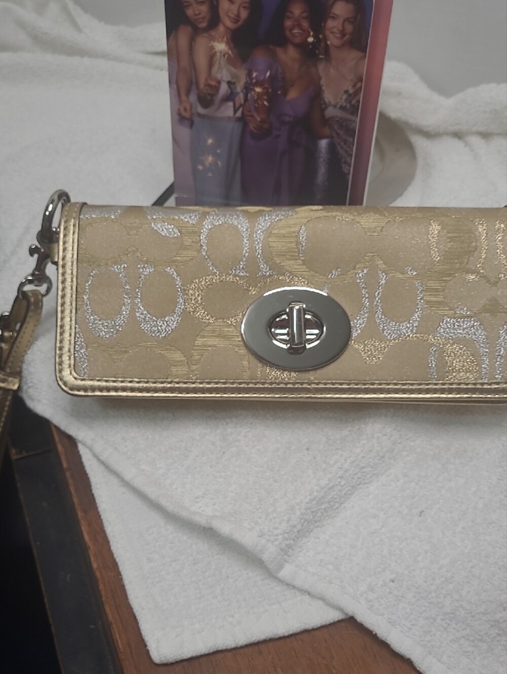 COACH Gold Metallic Signature Turnlock Wristlet - Picture 3 of 10